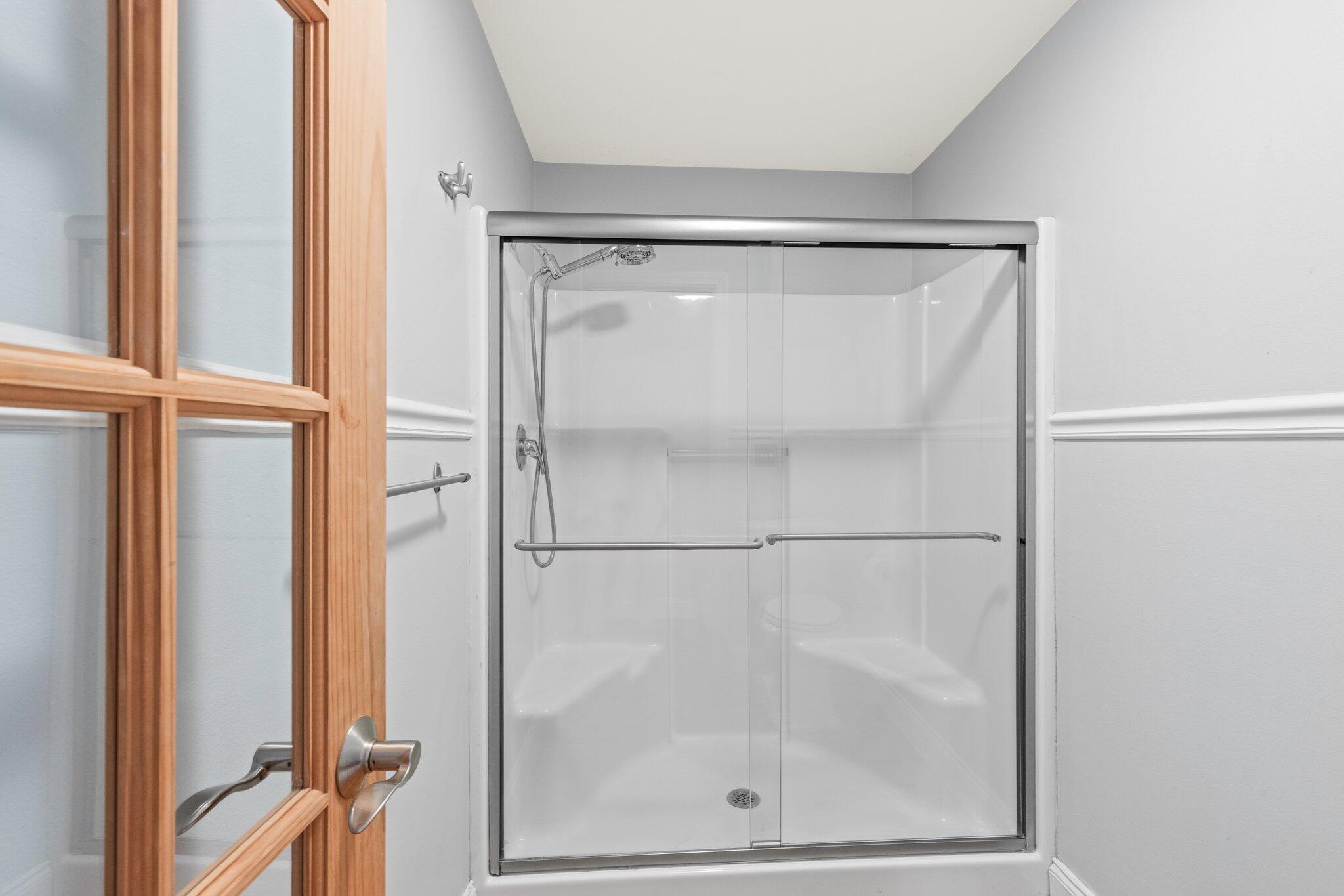 1756 Osterville West Barnstable Road West Barnstable, MA 02668 - Photo 31 of 62 a bathroom with a glass shower door