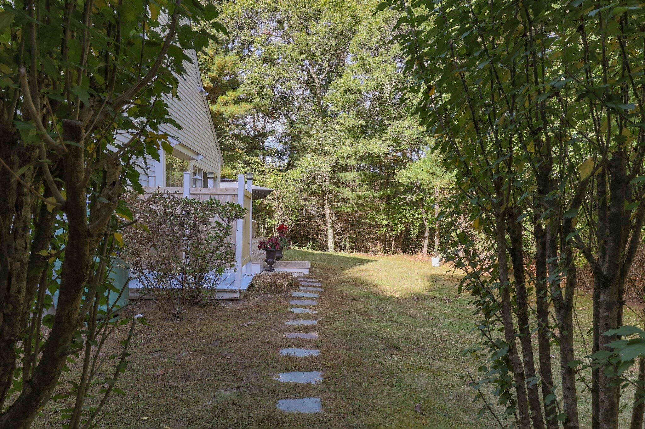1756 Osterville West Barnstable Road West Barnstable, MA 02668 - Photo 42 of 62 a view of a yard with plants and trees