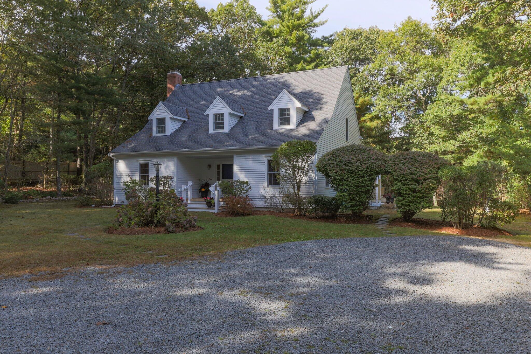 1756 Osterville West Barnstable Road West Barnstable, MA 02668 - Photo 55 of 62 a front view of a house with a yard and garage