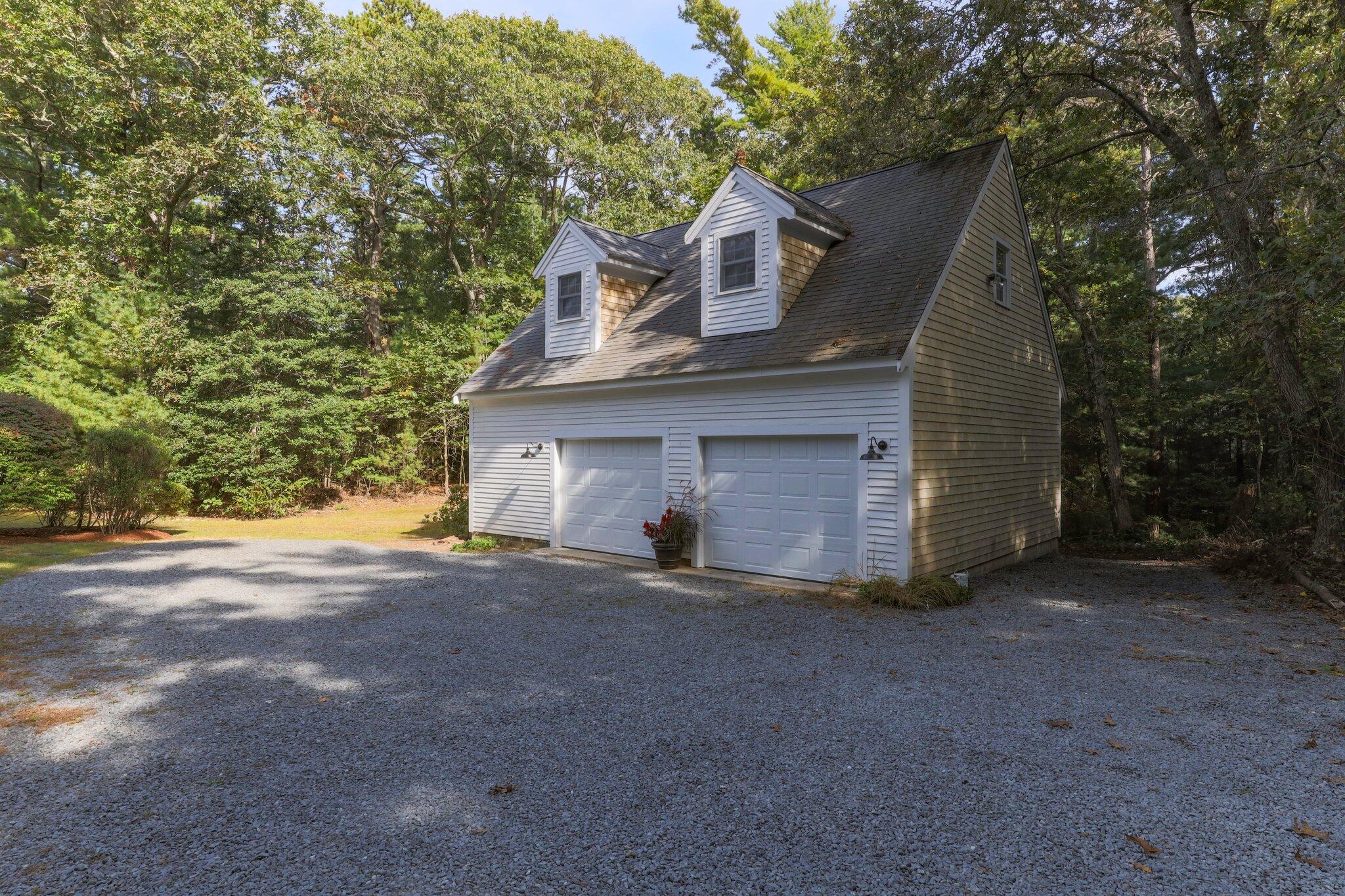 1756 Osterville West Barnstable Road West Barnstable, MA 02668 - Photo 57 of 62 a view of a house with a yard and garage