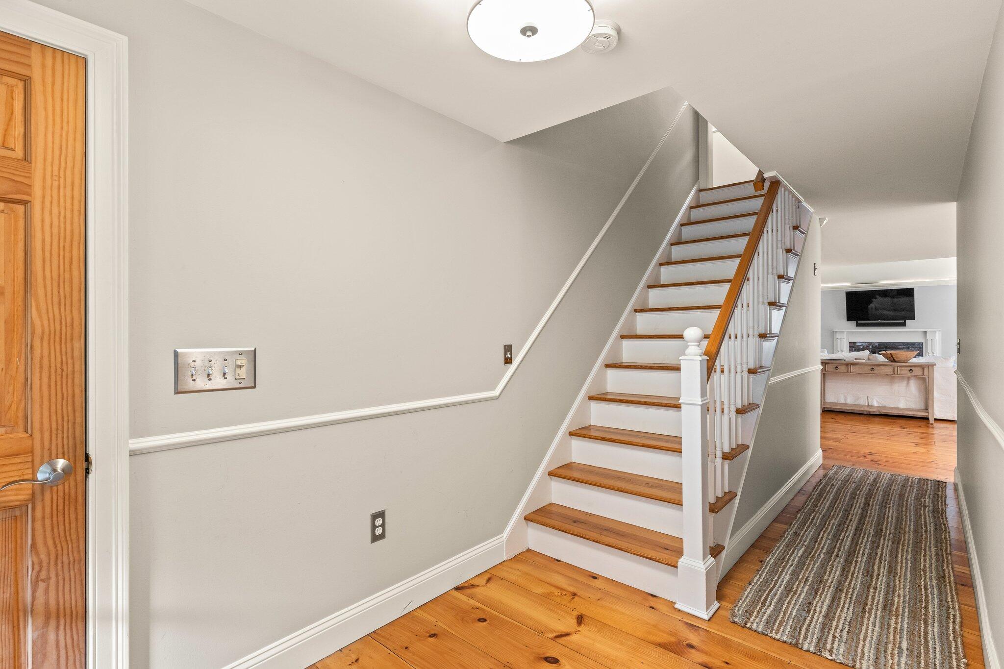 1756 Osterville West Barnstable Road West Barnstable, MA 02668 - Photo 6 of 62 a view of a hallway with staircase and wooden floor