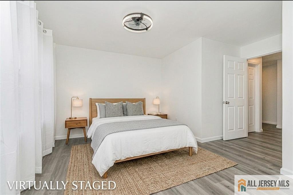 612 Chester Court Helmetta, NJ 08828 - Photo 4 of 31 a bedroom with a bed and a table