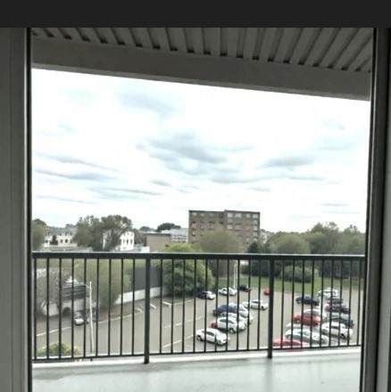 133 Commander Shea Boulevard, Unit 502 Quincy, MA 02171 - Photo 8 of 8 a balcony with a lake view