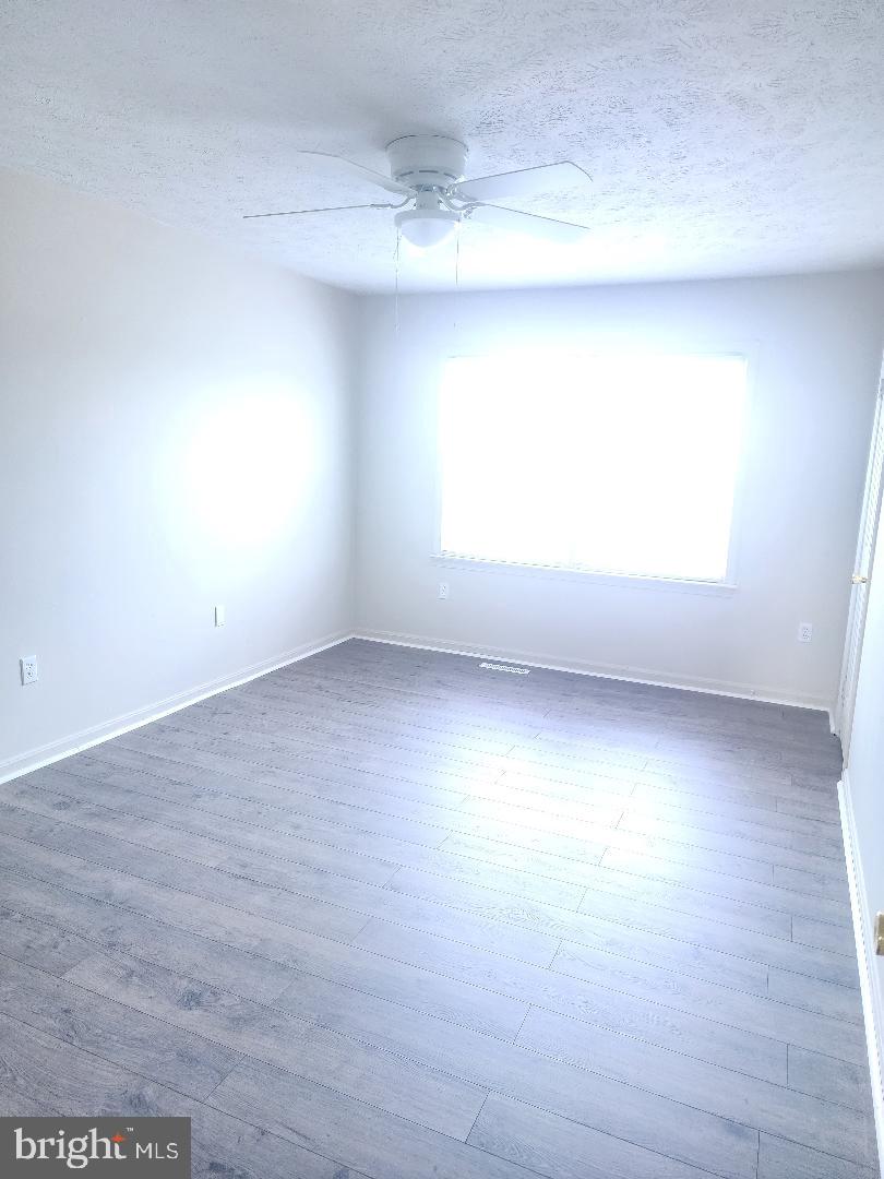 130-134 West 13th Street, Unit 134 Front Royal, VA 22630 - Photo 12 of 21 an empty room with a window