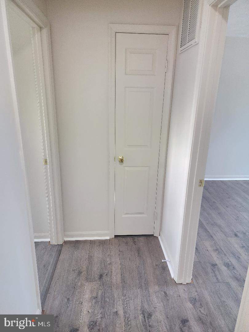 130-134 West 13th Street, Unit 134 Front Royal, VA 22630 - Photo 13 of 21 an empty room with wooden floor and closet