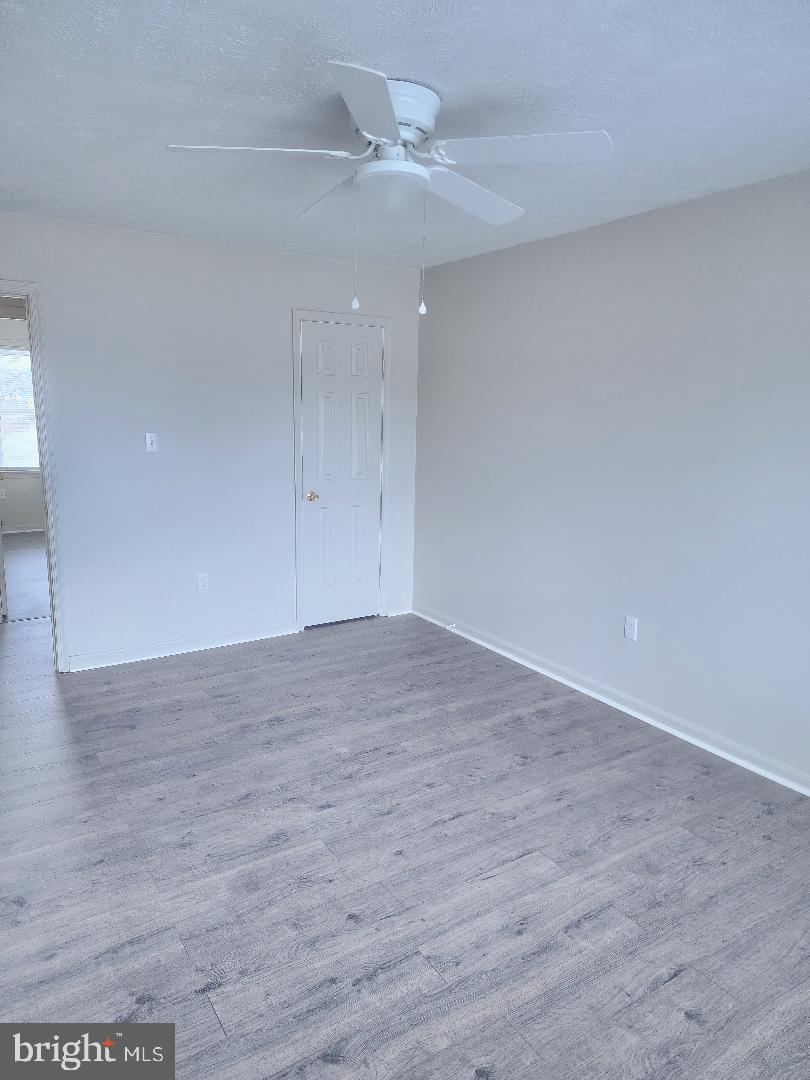 130-134 West 13th Street, Unit 134 Front Royal, VA 22630 - Photo 15 of 21 wooden floor in an empty room