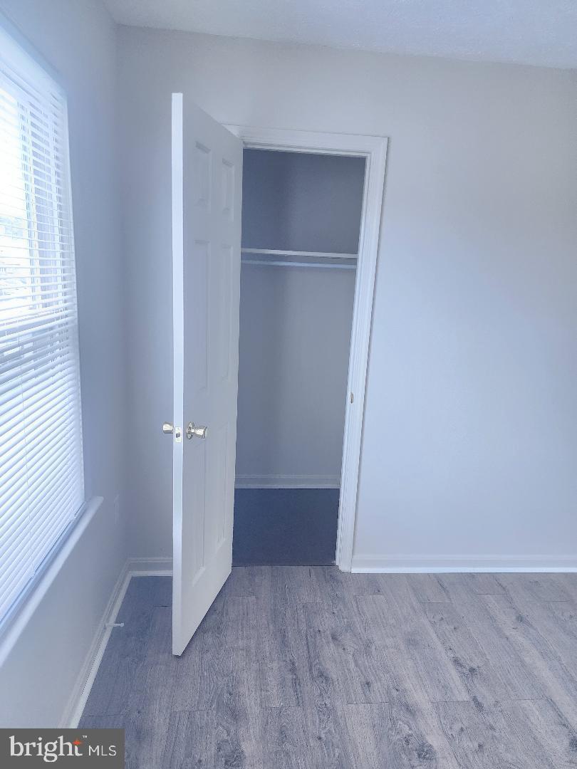 130-134 West 13th Street, Unit 134 Front Royal, VA 22630 - Photo 16 of 21 an empty room with windows and closet