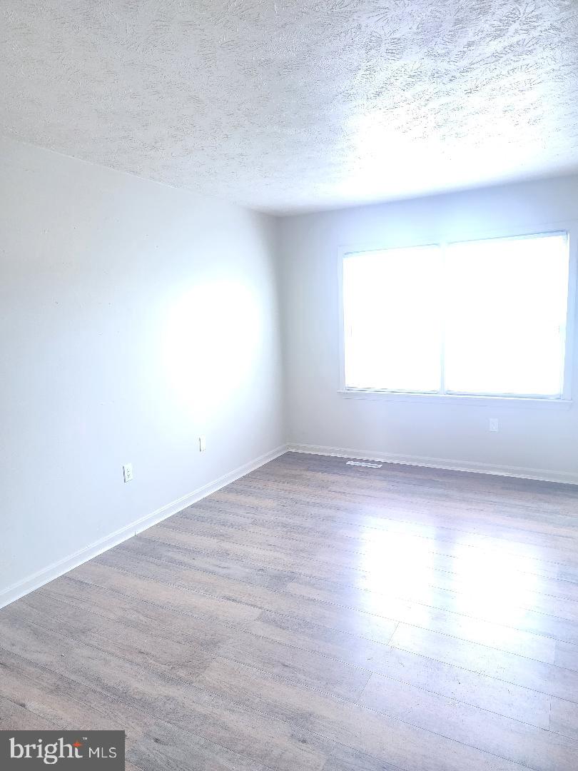 130-134 West 13th Street, Unit 134 Front Royal, VA 22630 - Photo 4 of 21 a view of an empty room and window