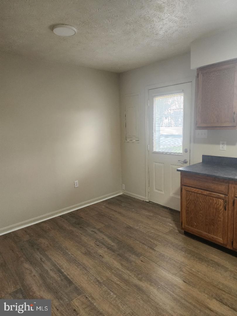 130-134 West 13th Street, Unit 134 Front Royal, VA 22630 - Photo 7 of 21 an empty room with a window