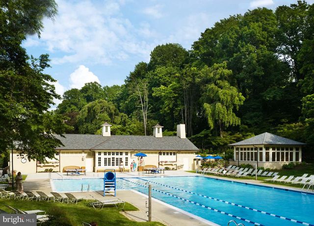 an outdoor view of the house and swimming pool