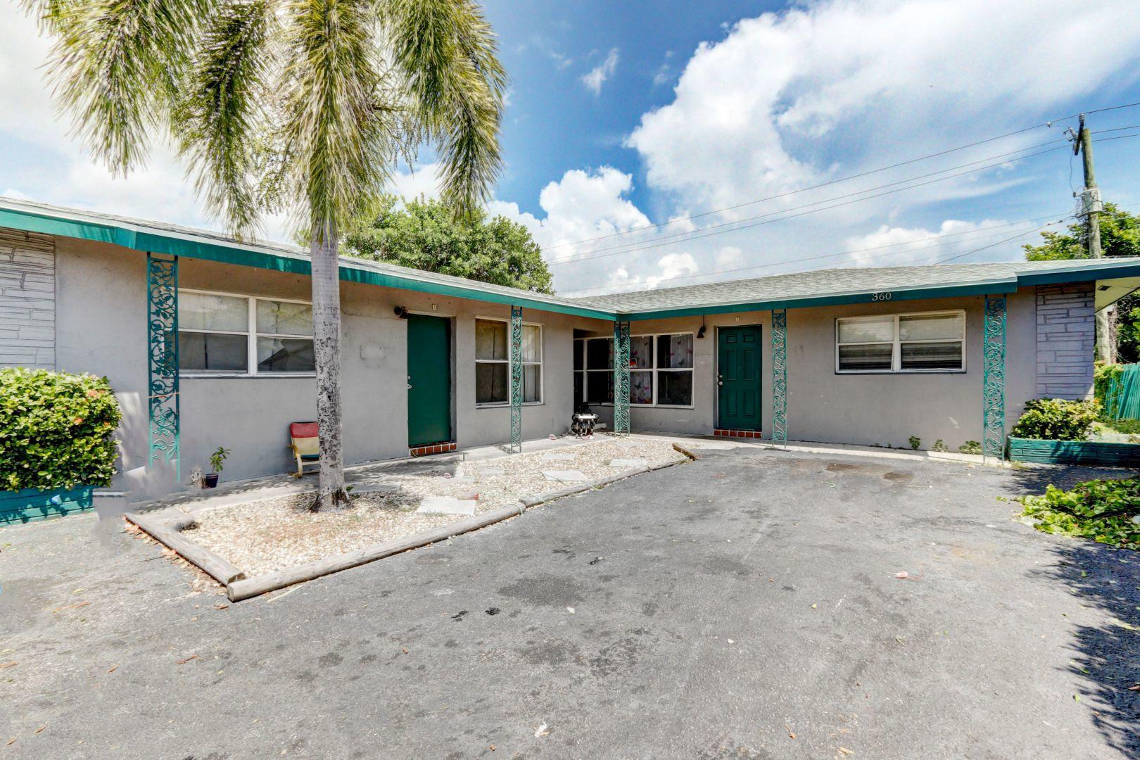 360 West Blue Heron Boulevard, Unit 1 Riviera Beach, FL 33404 - Photo 2 of 43 Front