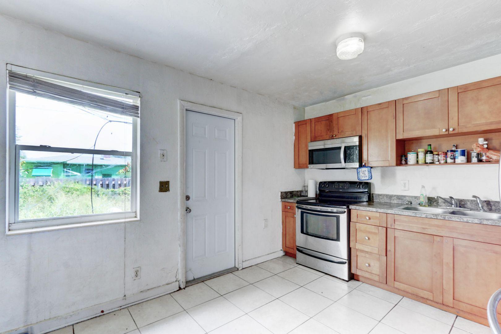 360 West Blue Heron Boulevard, Unit 1 Riviera Beach, FL 33404 - Photo 9 of 43 Kitchen