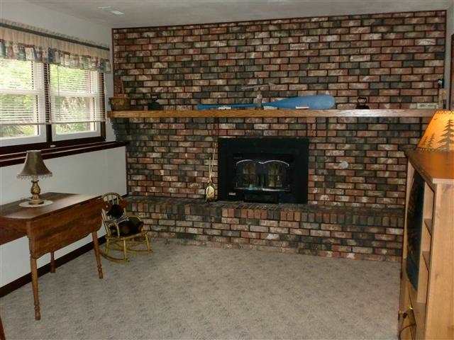 14877 Zahm Road Rockton, IL 61072 - Photo 14 of 15 a room with fireplace