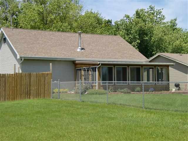 14877 Zahm Road Rockton, IL 61072 - Photo 4 of 15 a house with green field in front of it