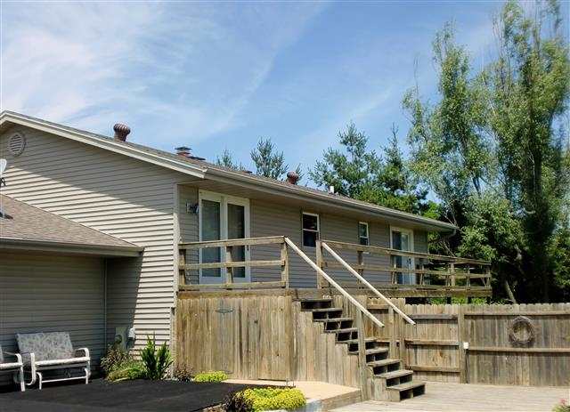 14877 Zahm Road Rockton, IL 61072 - Photo 5 of 15 a roof deck with table and chairs