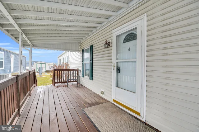 a view of a balcony with wooden floor