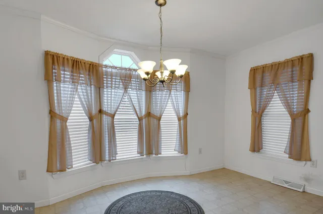 a view of a livingroom with windows