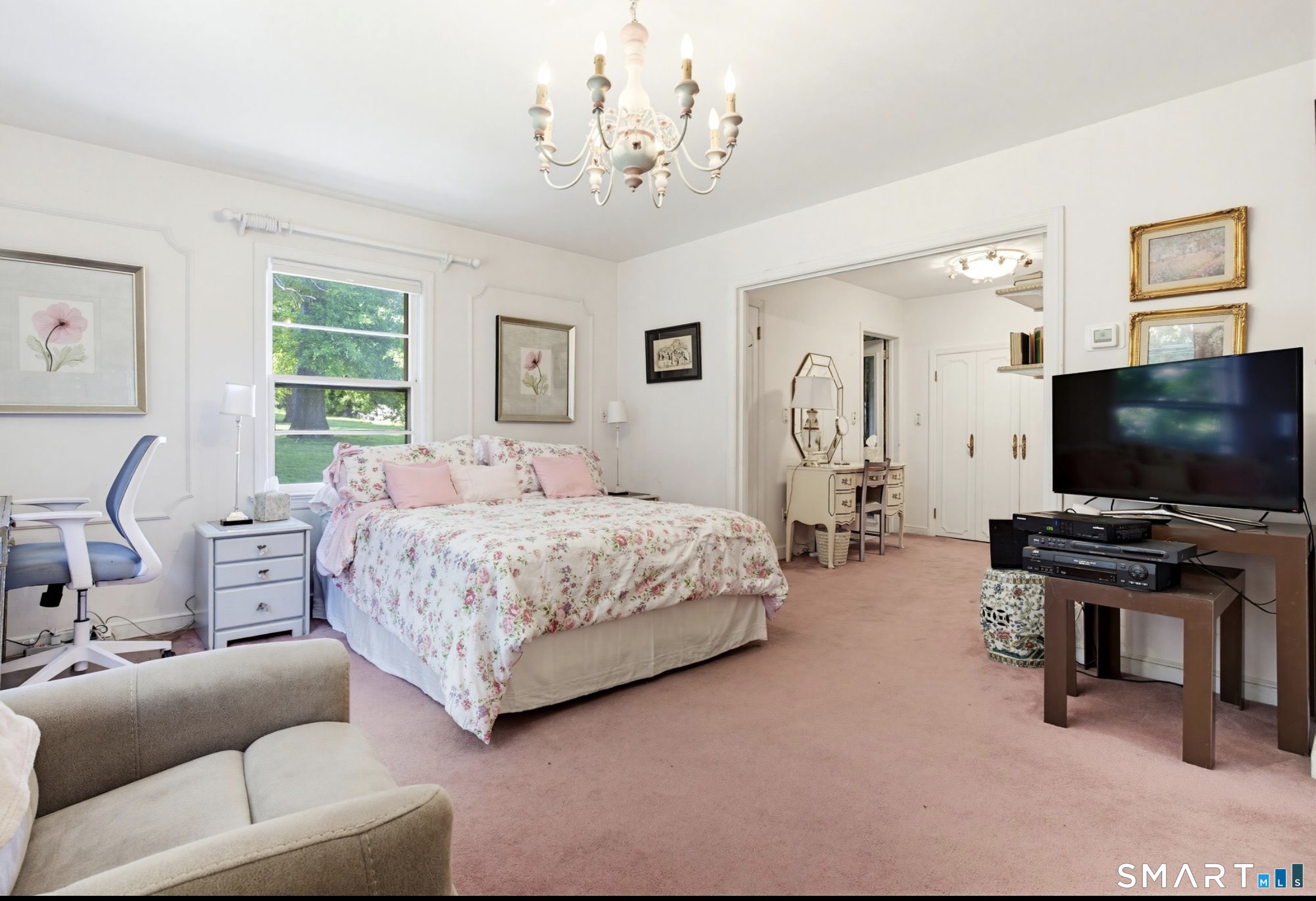 7 Sasqua Road Norwalk, CT 06855 - Photo 21 of 40 a bedroom with a bed and a chandelier