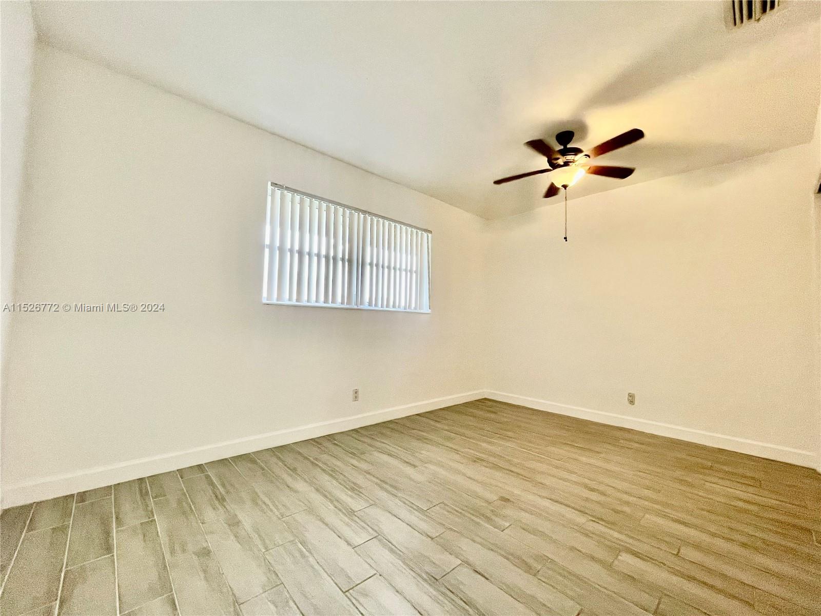 215 Southwest 10th Street Hallandale Beach, FL 33009 - Photo 11 of 18 wooden floor in an empty room