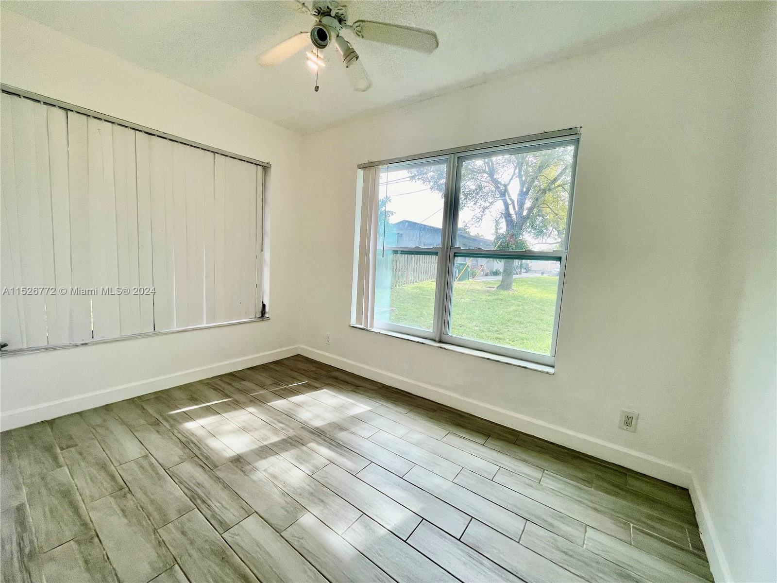 215 Southwest 10th Street Hallandale Beach, FL 33009 - Photo 12 of 18 a view of an empty room and window