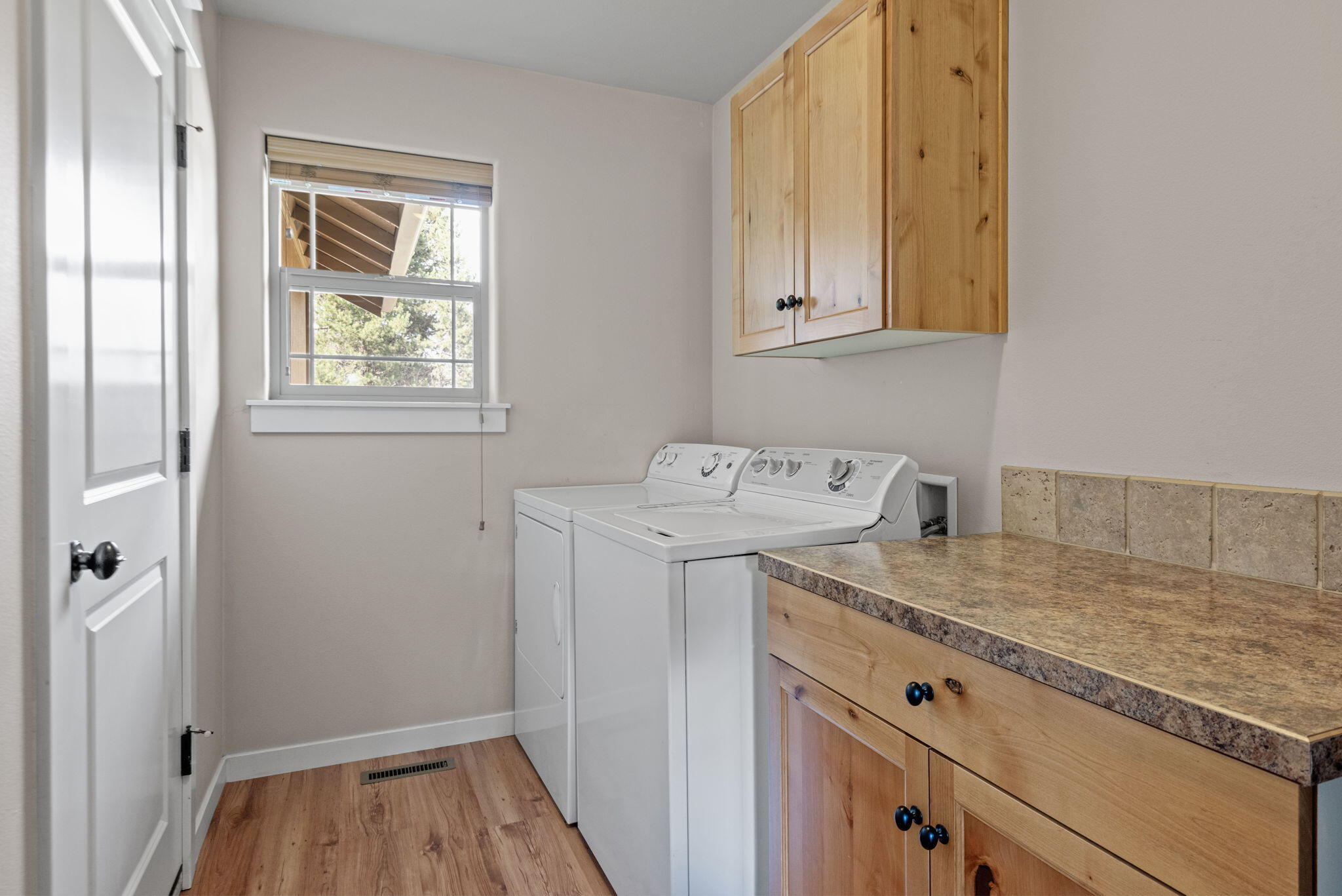 19167 Pumice Butte Road Bend, OR 97702 - Photo 14 of 20 a utility room with dryer and washer