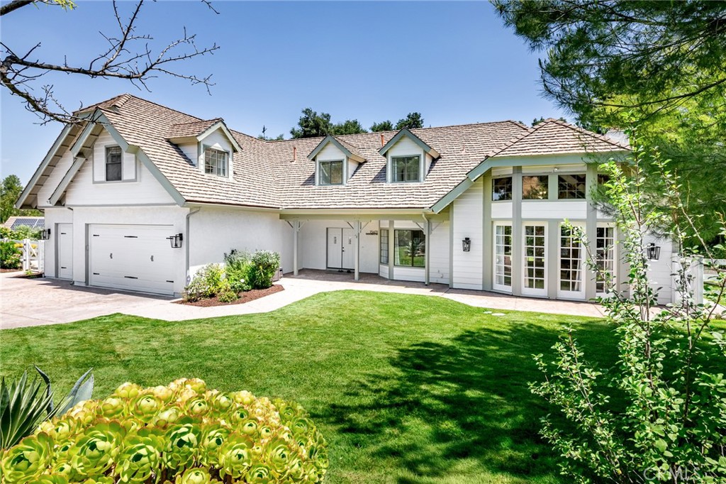 15601 Saddleback Road Canyon Country, CA 91387 - Photo 1 of 55 a front view of a house with a yard and garage