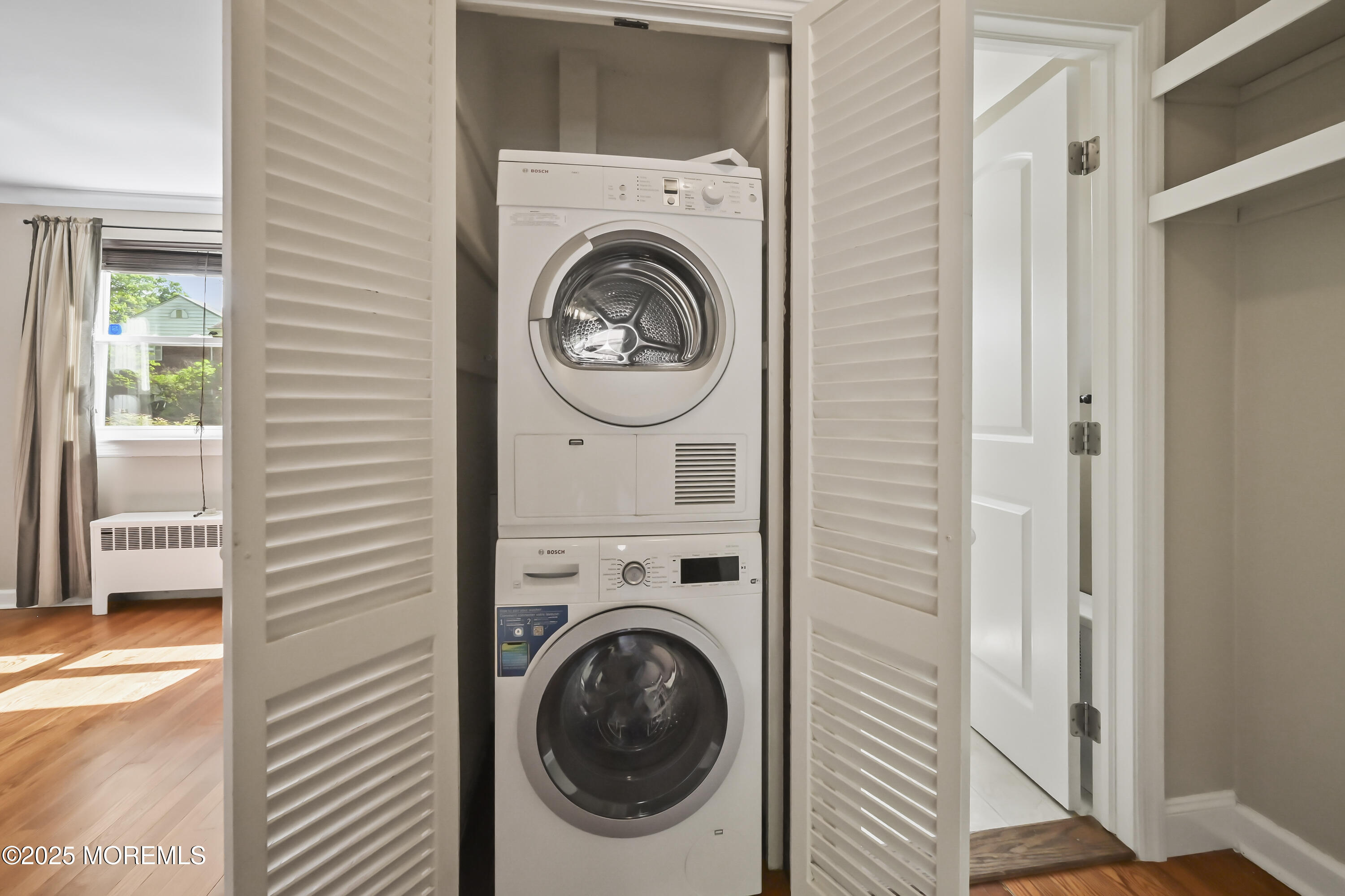 82 Manor Drive, Unit 803 Red Bank, NJ 07701 - Photo 15 of 19 a view of a hallway with washer and dryer