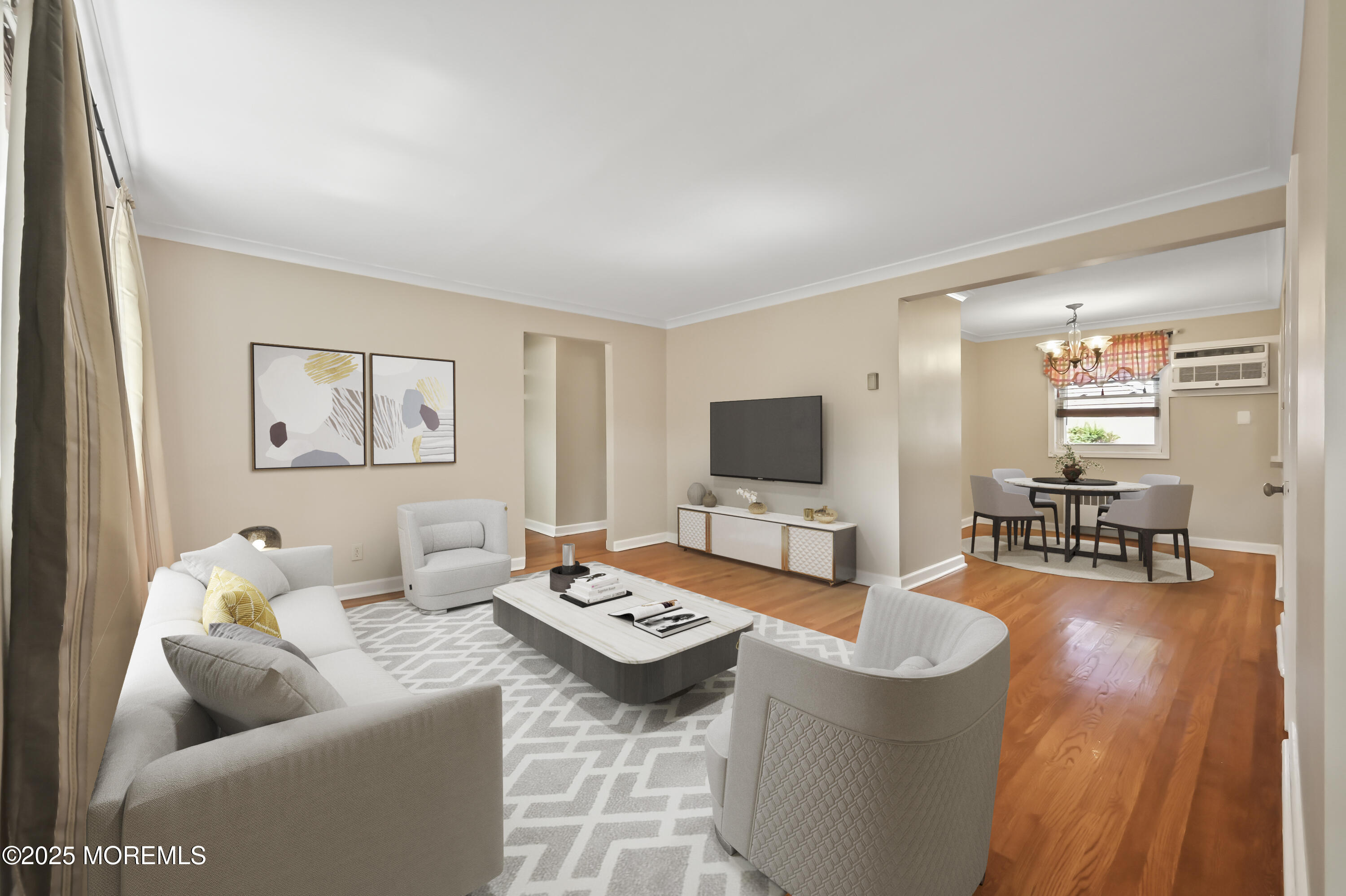 82 Manor Drive, Unit 803 Red Bank, NJ 07701 - Photo 3 of 19 a living room with furniture and a flat screen tv