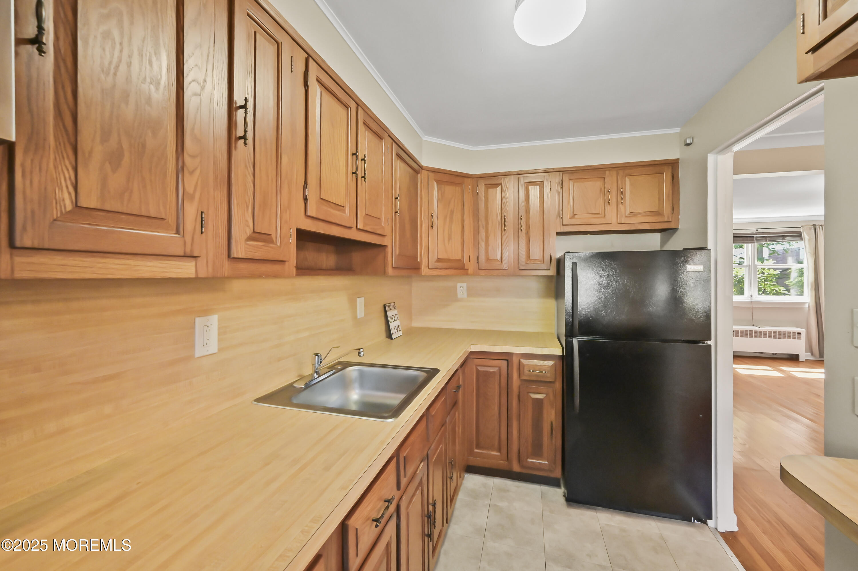82 Manor Drive, Unit 803 Red Bank, NJ 07701 - Photo 10 of 19 a kitchen with stainless steel appliances granite countertop a refrigerator a sink and dishwasher