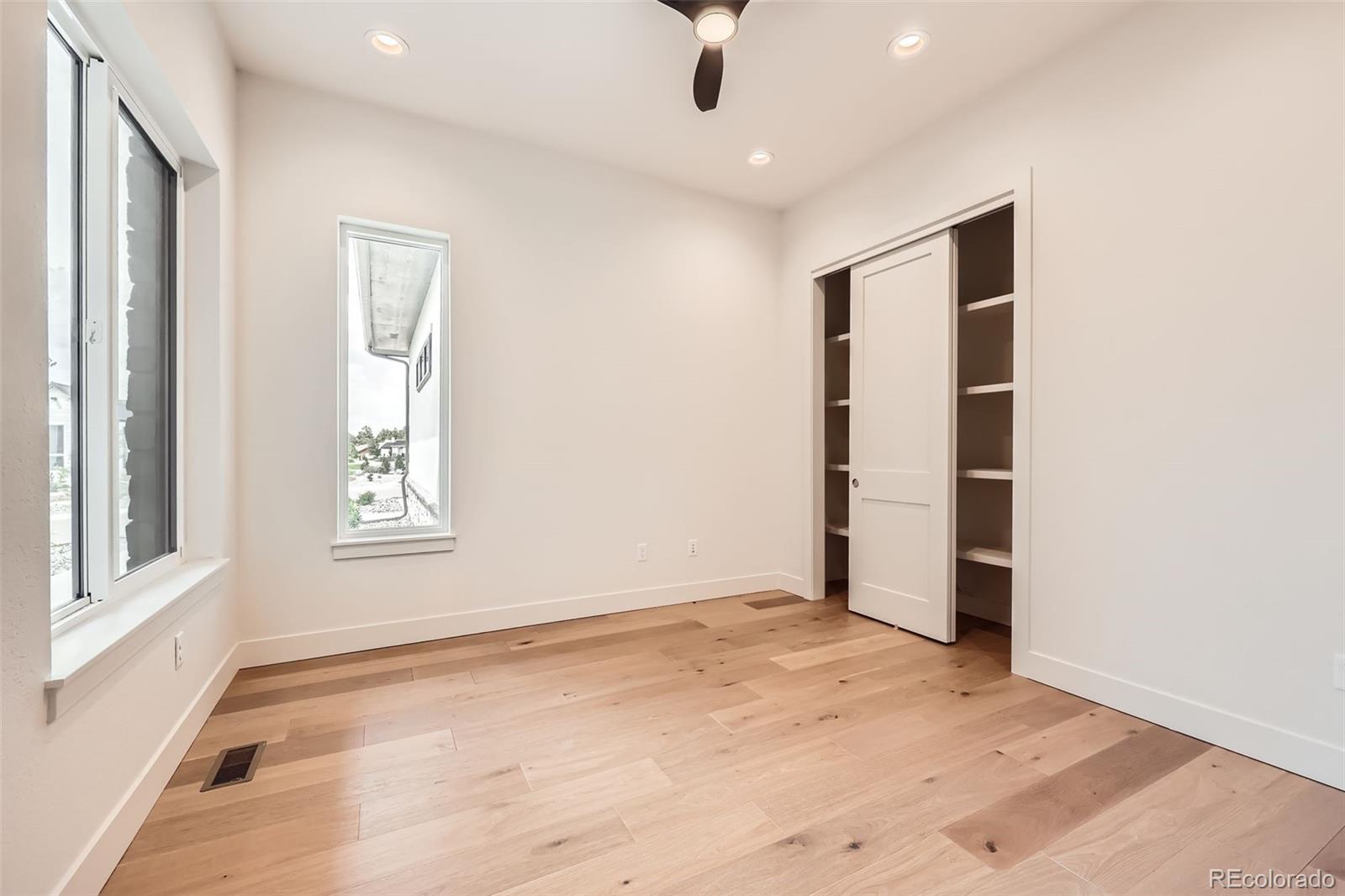 5841 Powell Road Parker, CO 80134 - Photo 15 of 50 an empty room with windows and closet