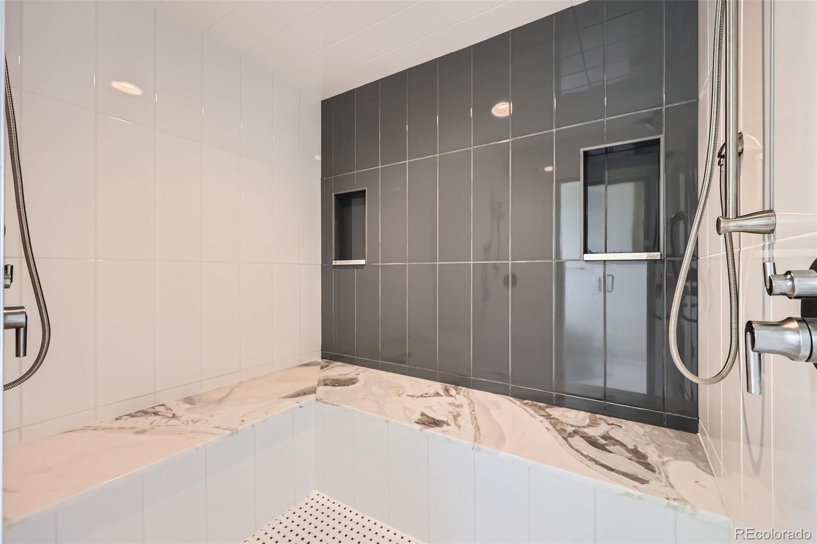 5841 Powell Road Parker, CO 80134 - Photo 23 of 50 a bathroom with a tub and a shower