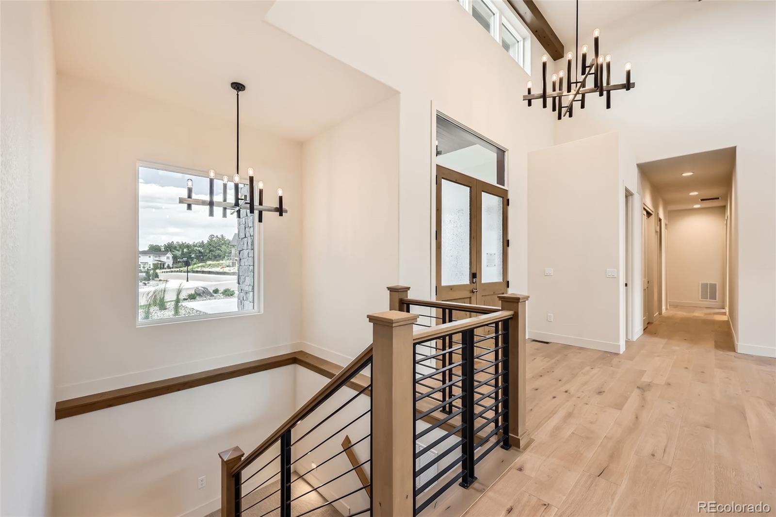 5841 Powell Road Parker, CO 80134 - Photo 31 of 50 a view of a hallway with windows