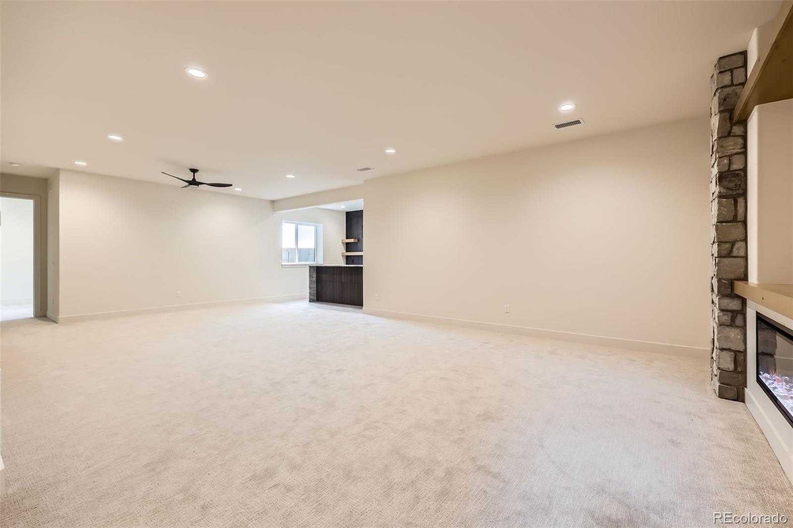 5841 Powell Road Parker, CO 80134 - Photo 36 of 50 a view of empty room with a kitchen
