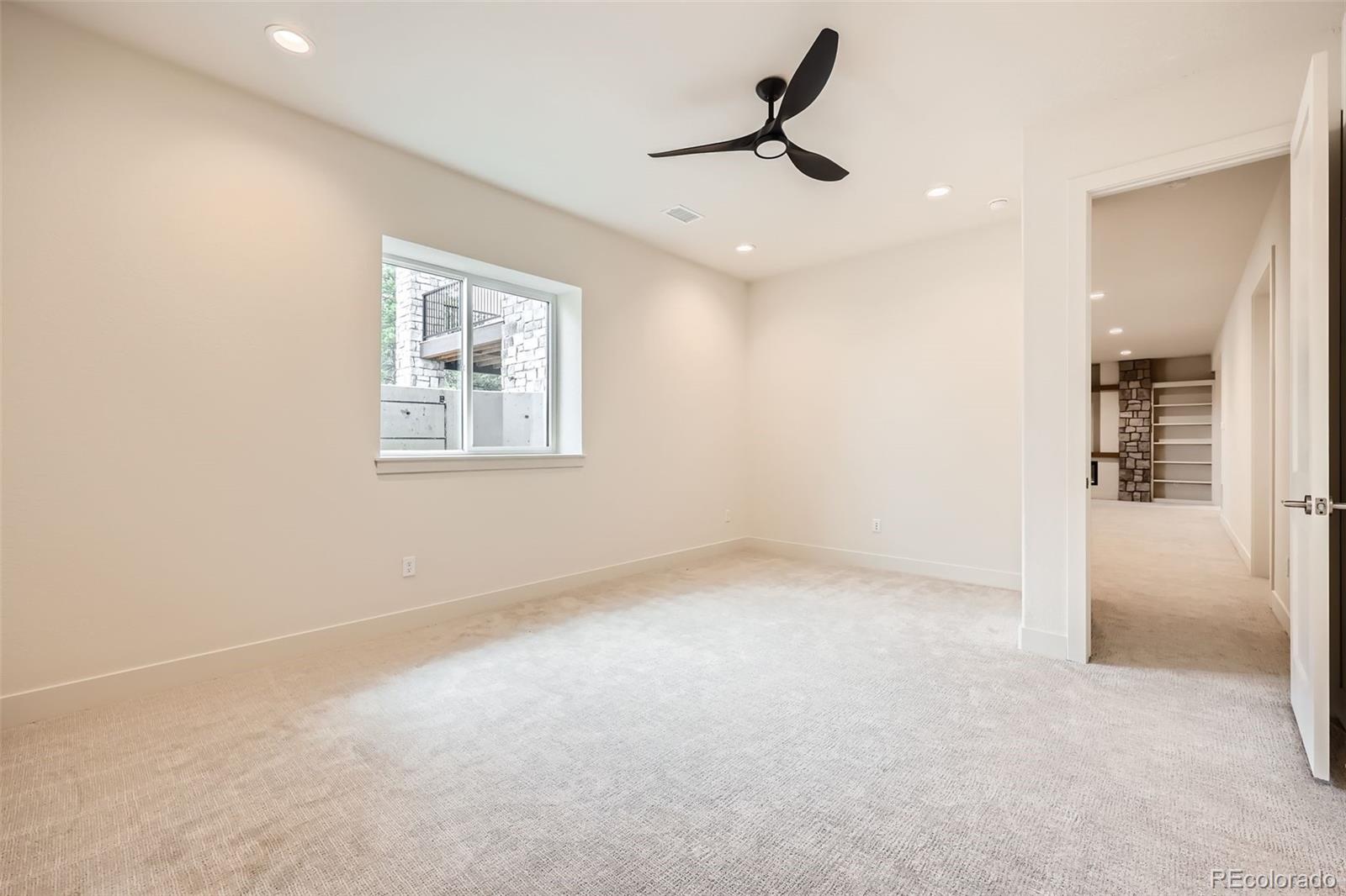 5841 Powell Road Parker, CO 80134 - Photo 37 of 50 an empty room with a empty space and windows