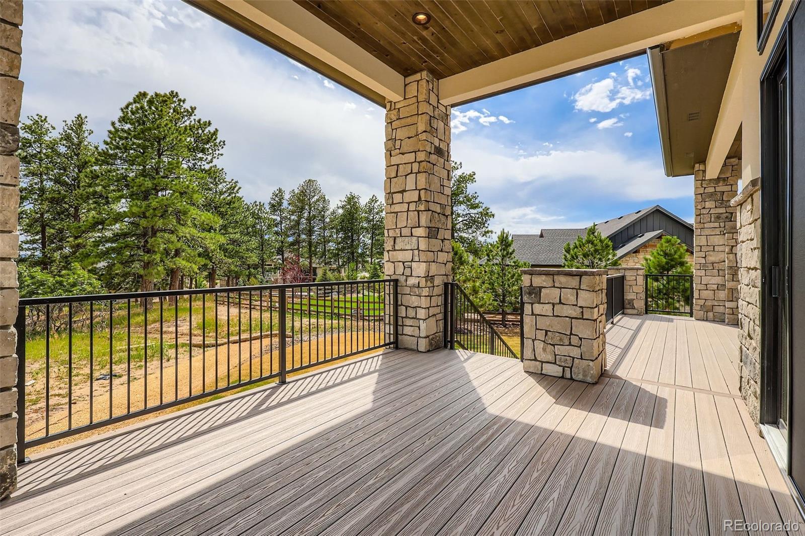 5841 Powell Road Parker, CO 80134 - Photo 44 of 50 a view of balcony with wooden floor and fence