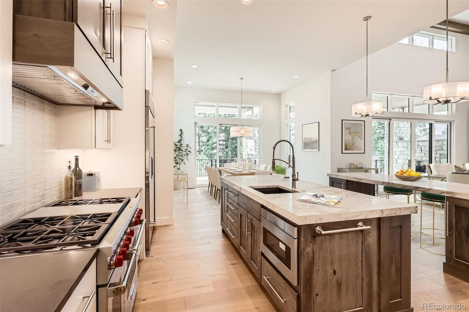 5841 Powell Road Parker, CO 80134 - Photo 47 of 50 a kitchen with a stove and a sink