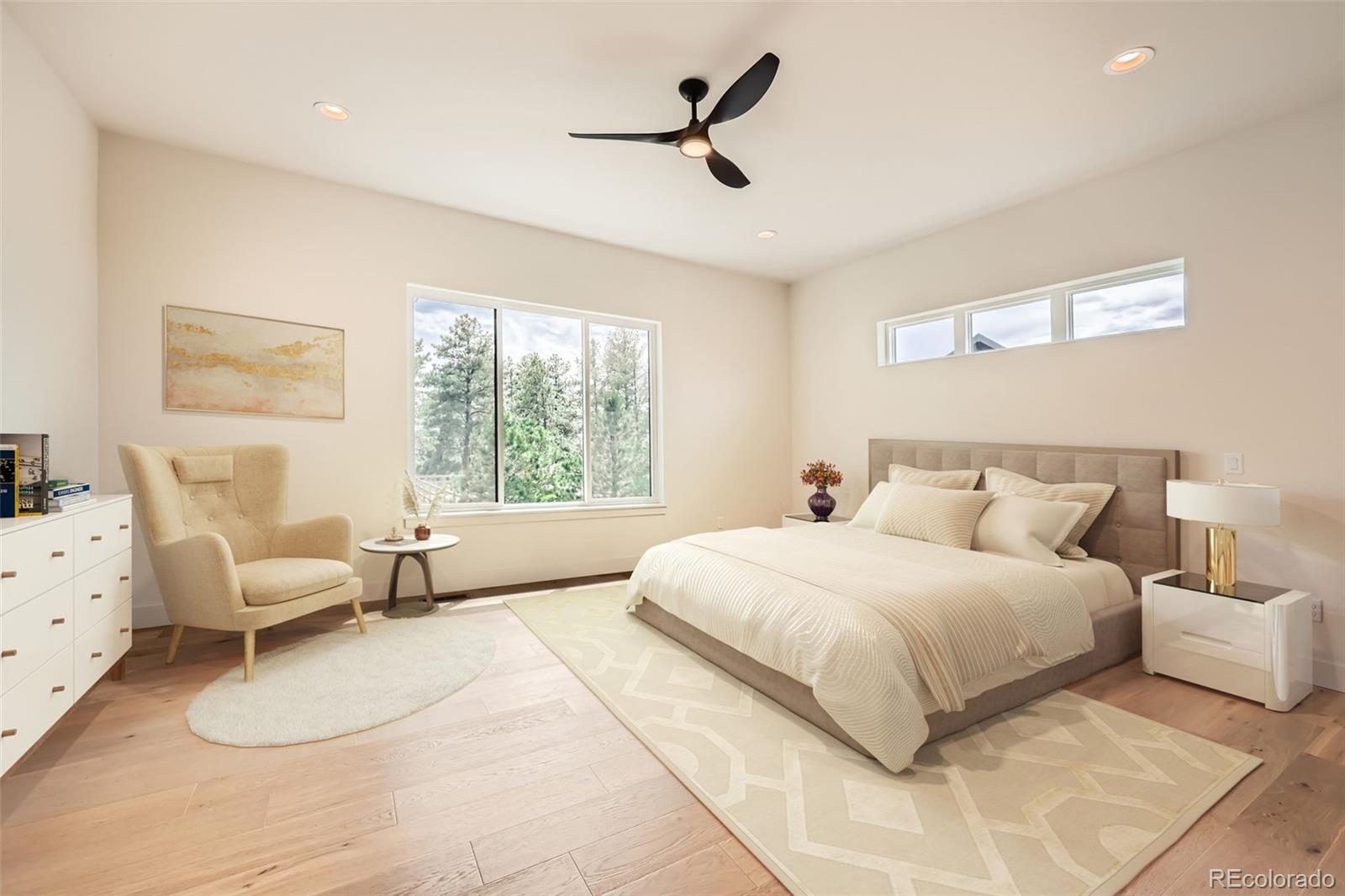 5841 Powell Road Parker, CO 80134 - Photo 48 of 50 a bedroom with a bed and white couch