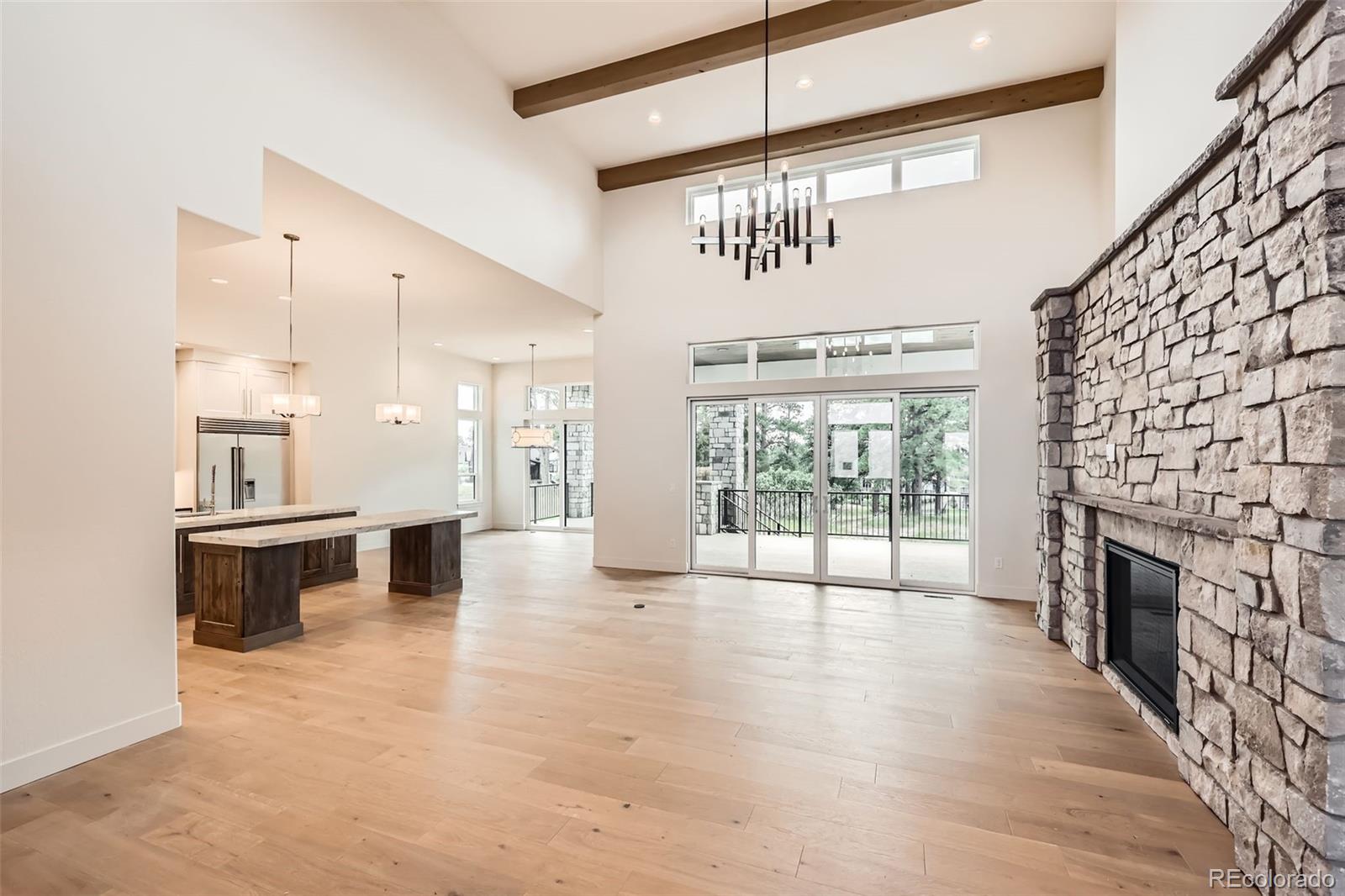 5841 Powell Road Parker, CO 80134 - Photo 7 of 50 a view of an empty room with a fireplace