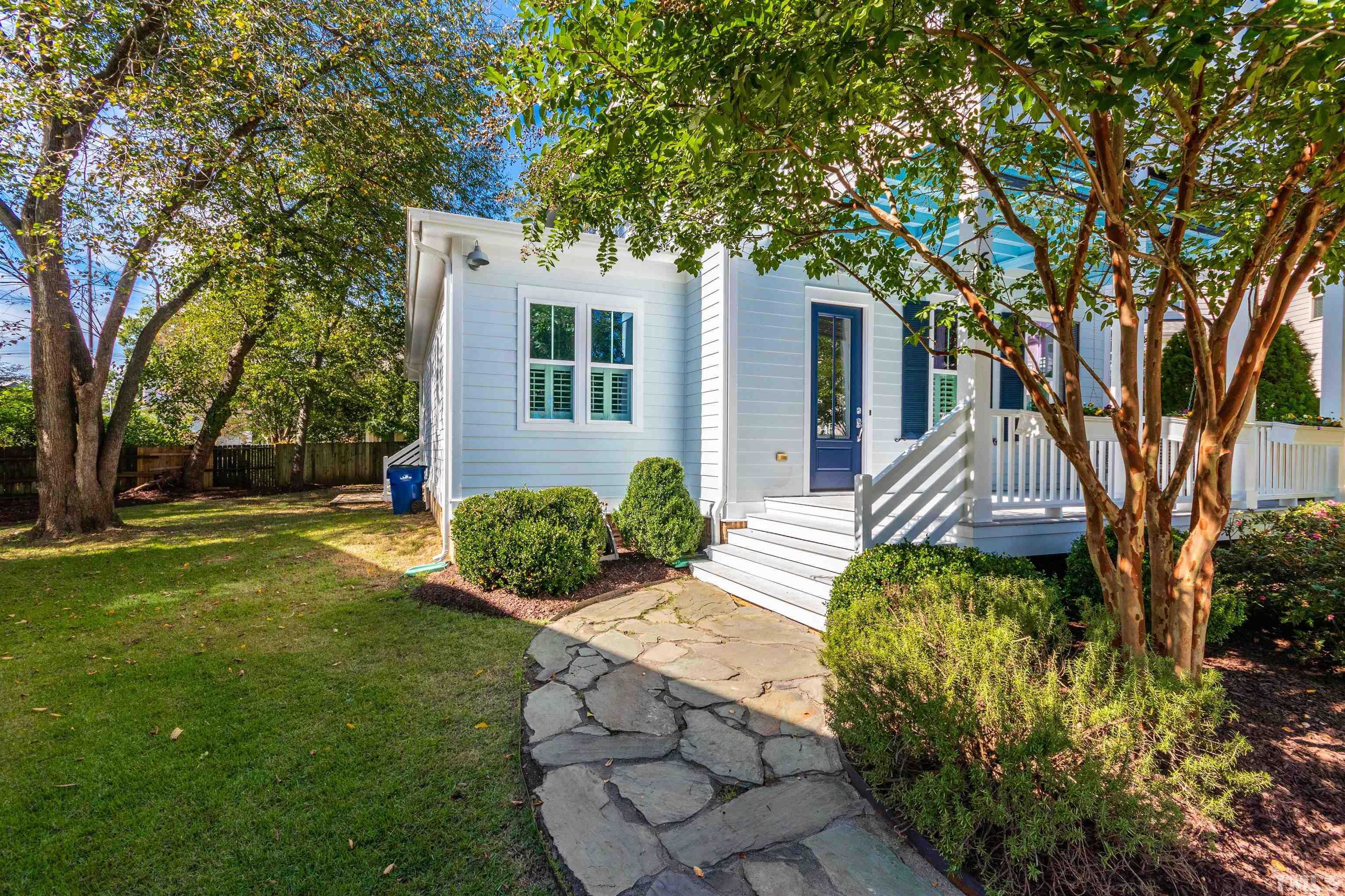 610 New Road Raleigh, NC 27608 - Photo 2 of 24 a front view of a house with garden