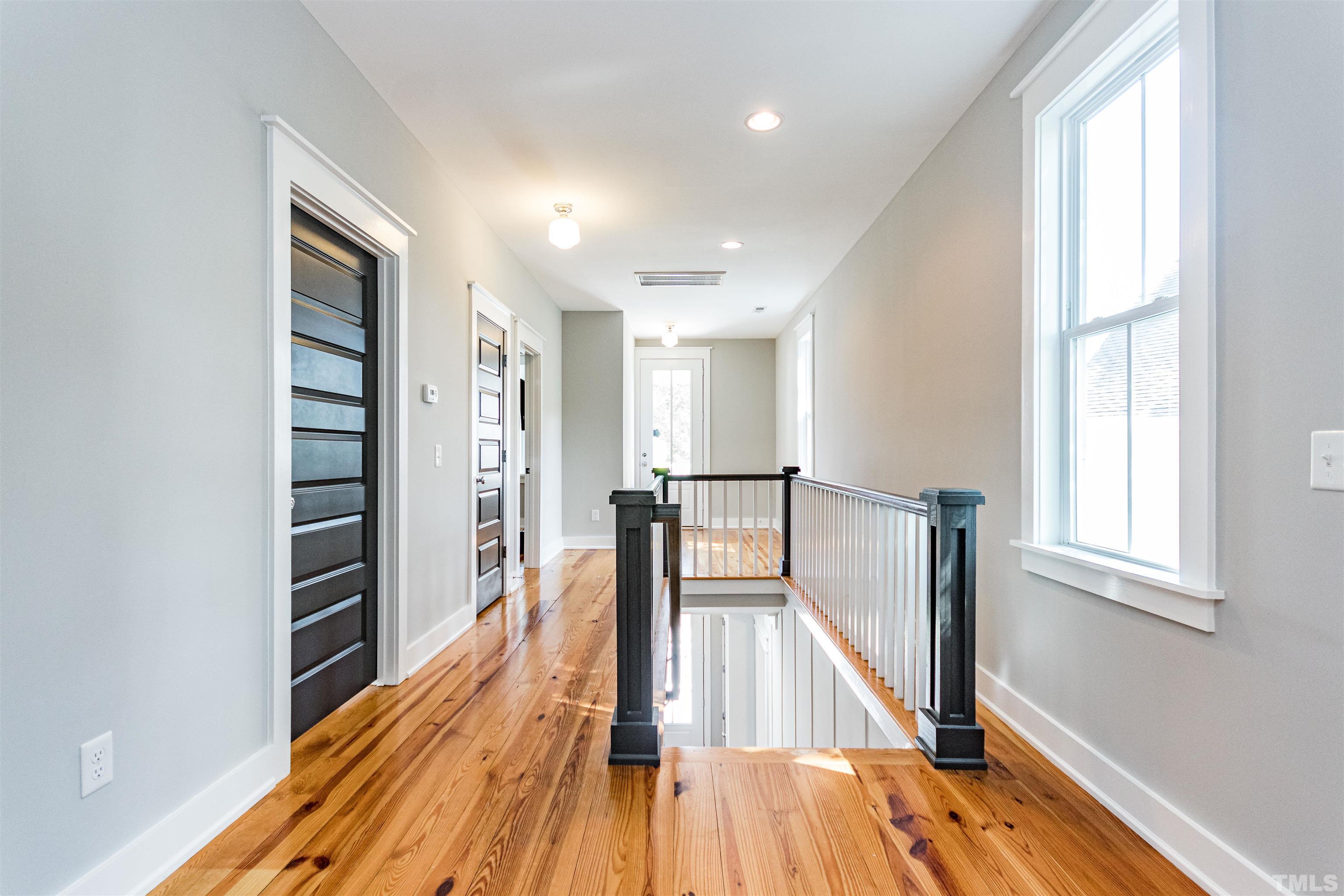 610 New Road Raleigh, NC 27608 - Photo 20 of 24 wooden floor in an empty room with a window