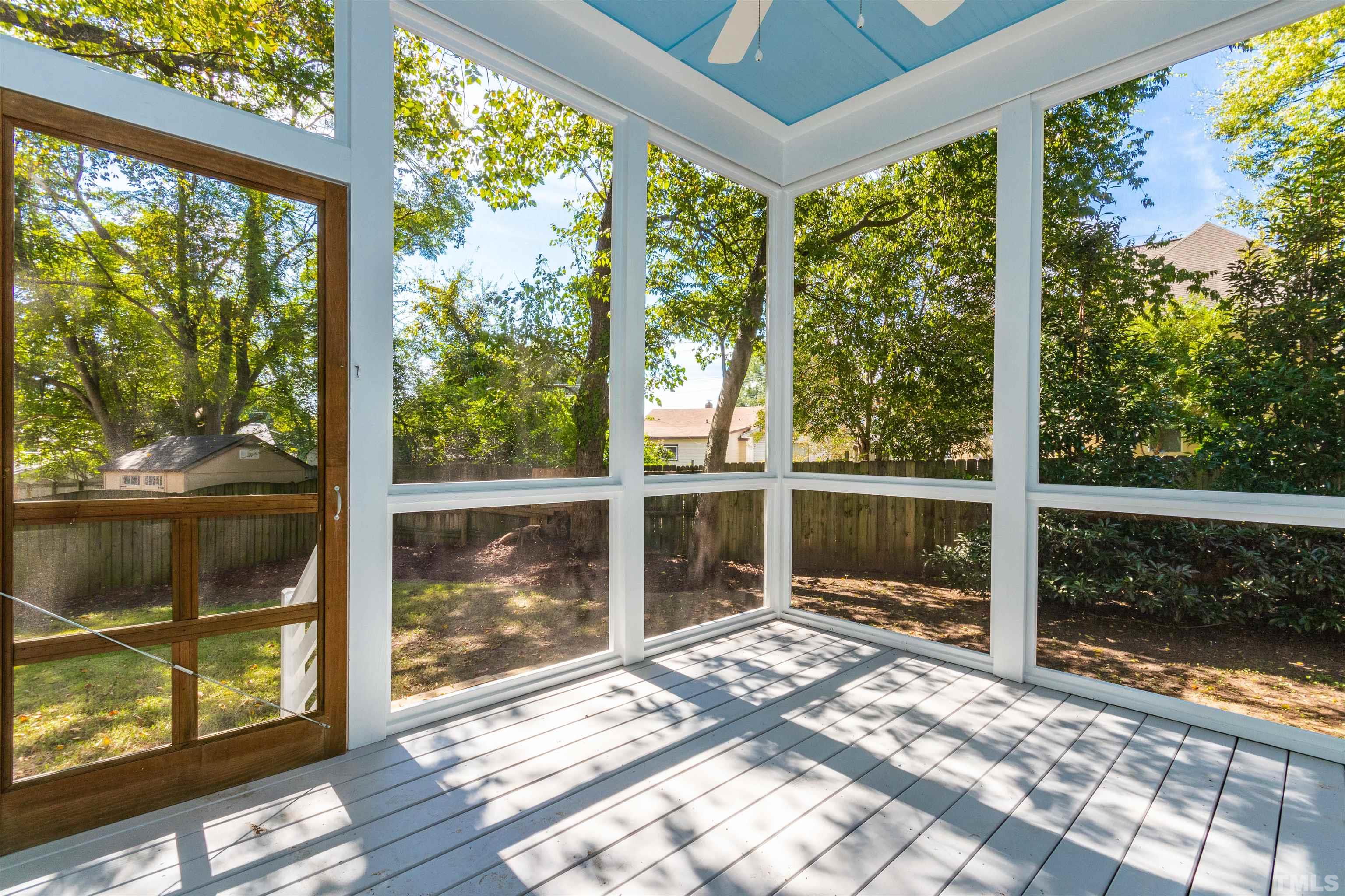 610 New Road Raleigh, NC 27608 - Photo 24 of 24 a view of a glass door with a yard
