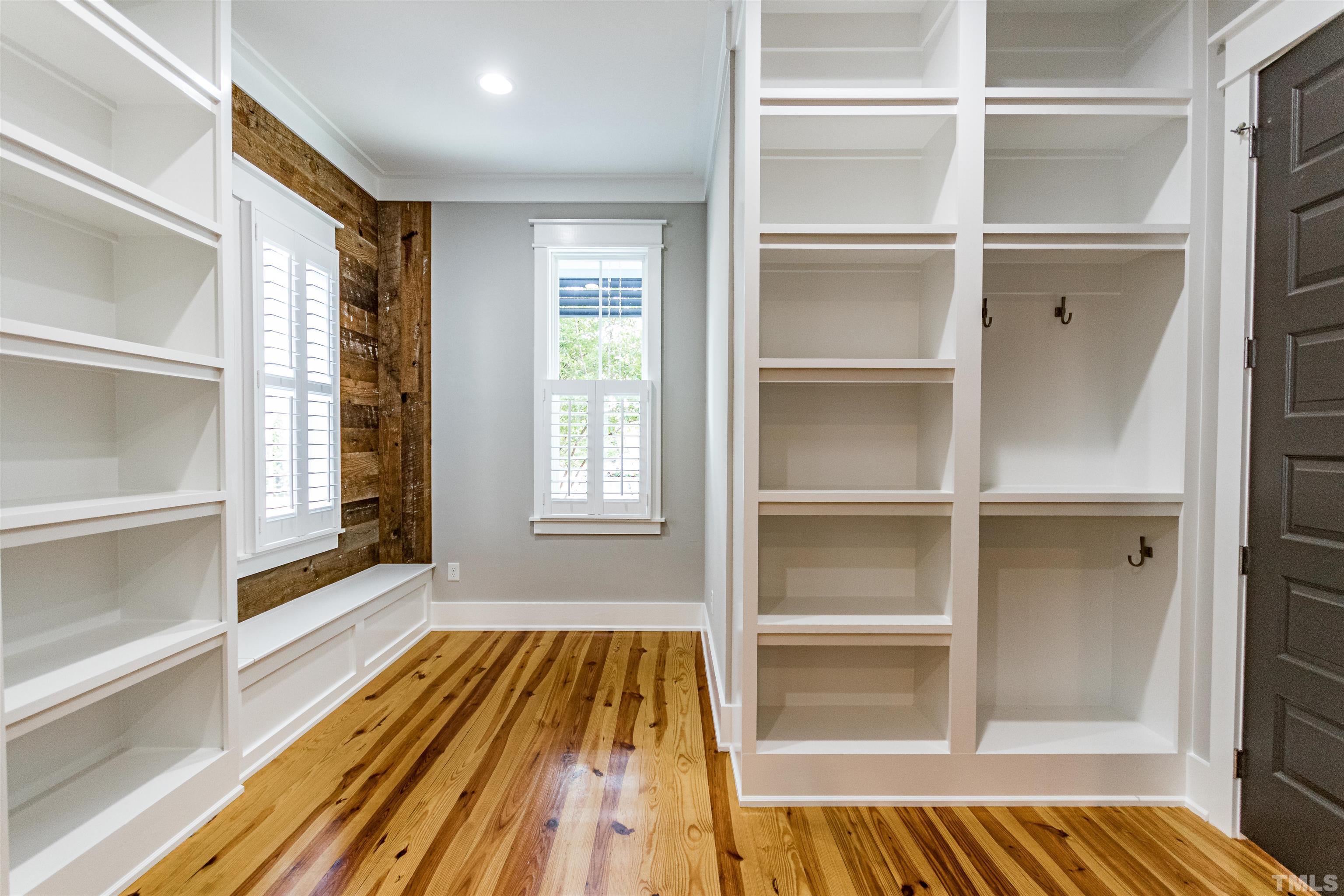 610 New Road Raleigh, NC 27608 - Photo 10 of 24 a view of a room with wooden floor and windows