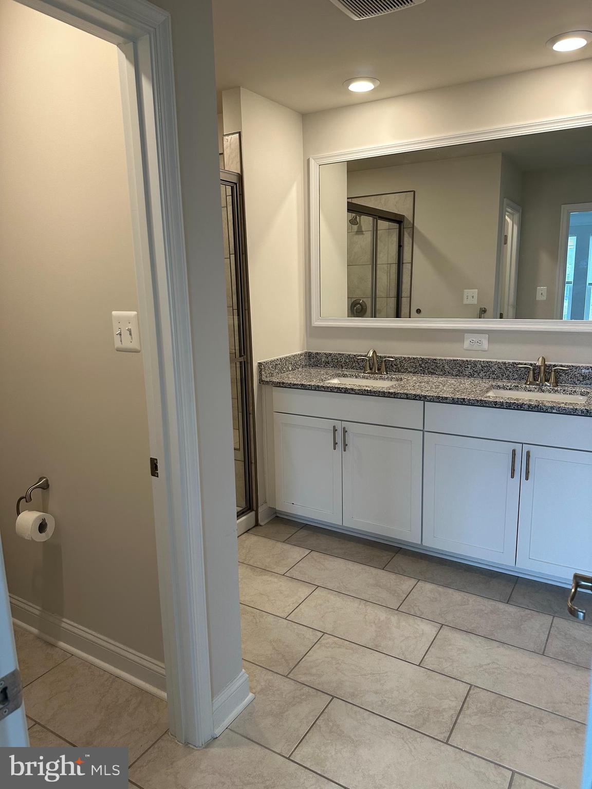 35422 Wright Way Millsboro, DE 19966 - Photo 28 of 35 a bathroom with a granite countertop sink a mirror and a toilet