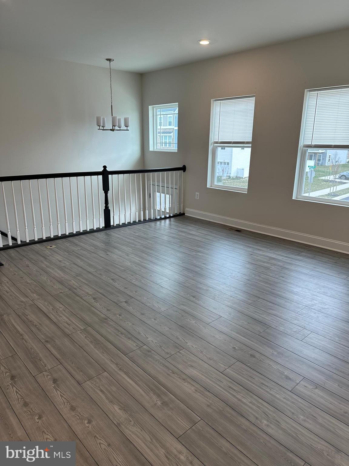 35422 Wright Way Millsboro, DE 19966 - Photo 4 of 35 an empty room with wooden floor and windows