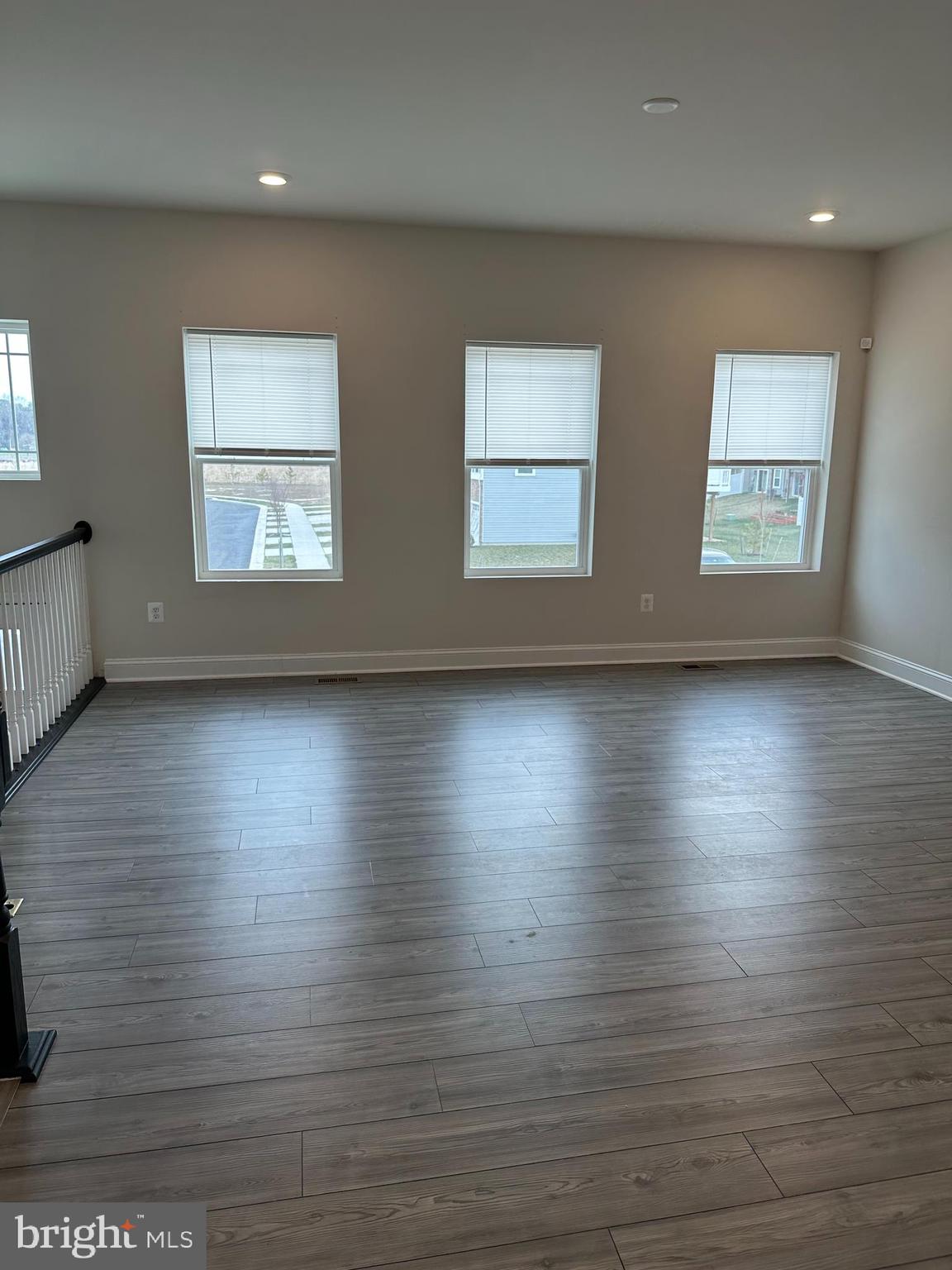 35422 Wright Way Millsboro, DE 19966 - Photo 5 of 35 an empty room with wooden floor and windows