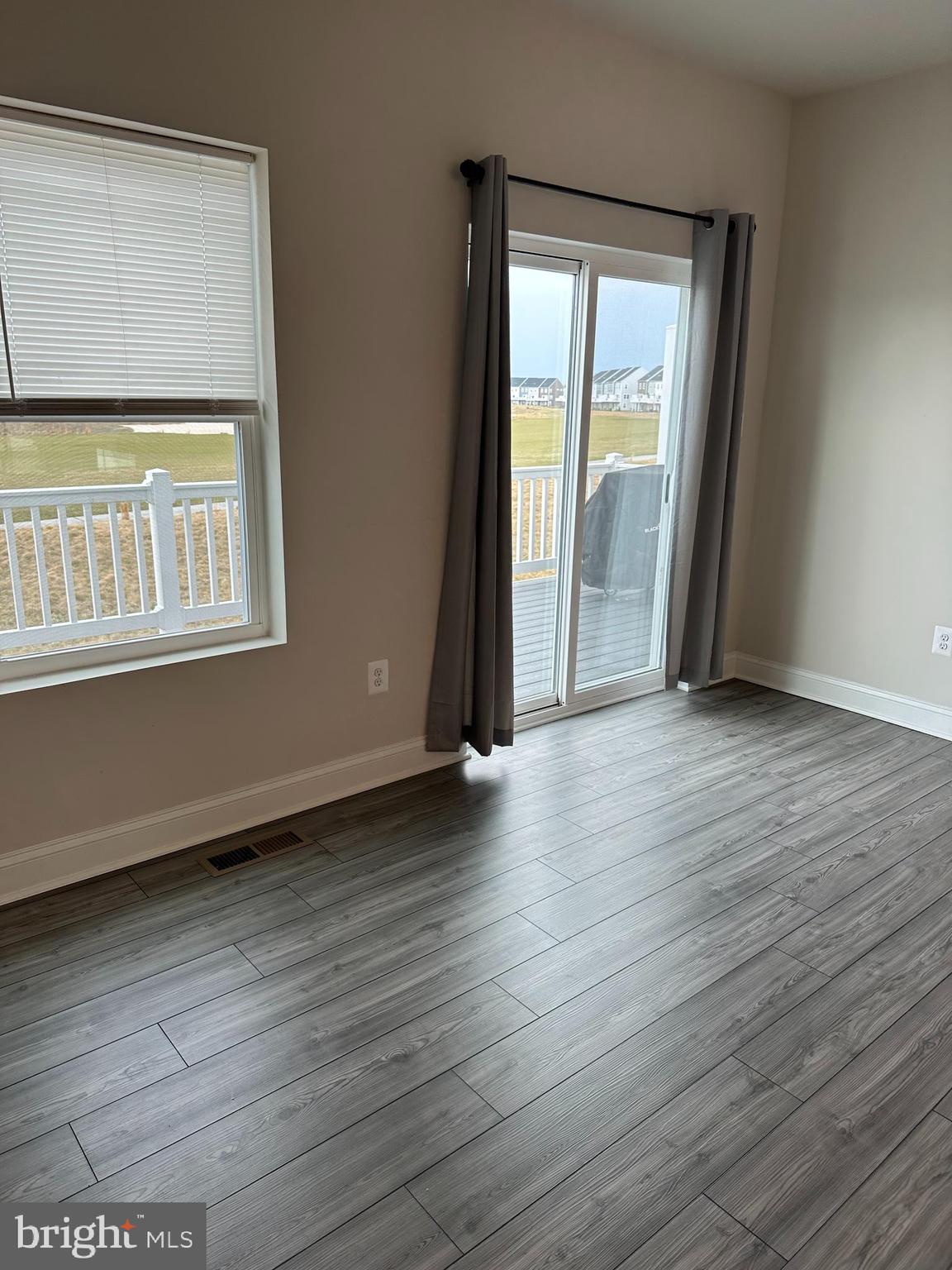 35422 Wright Way Millsboro, DE 19966 - Photo 10 of 35 an empty room with wooden floor and windows