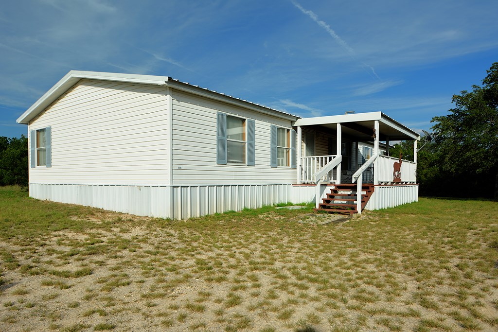 22874 Ranch Road 385 Harper, TX 78631 - Photo 22 of 31 a view of a house with backyard and sitting area
