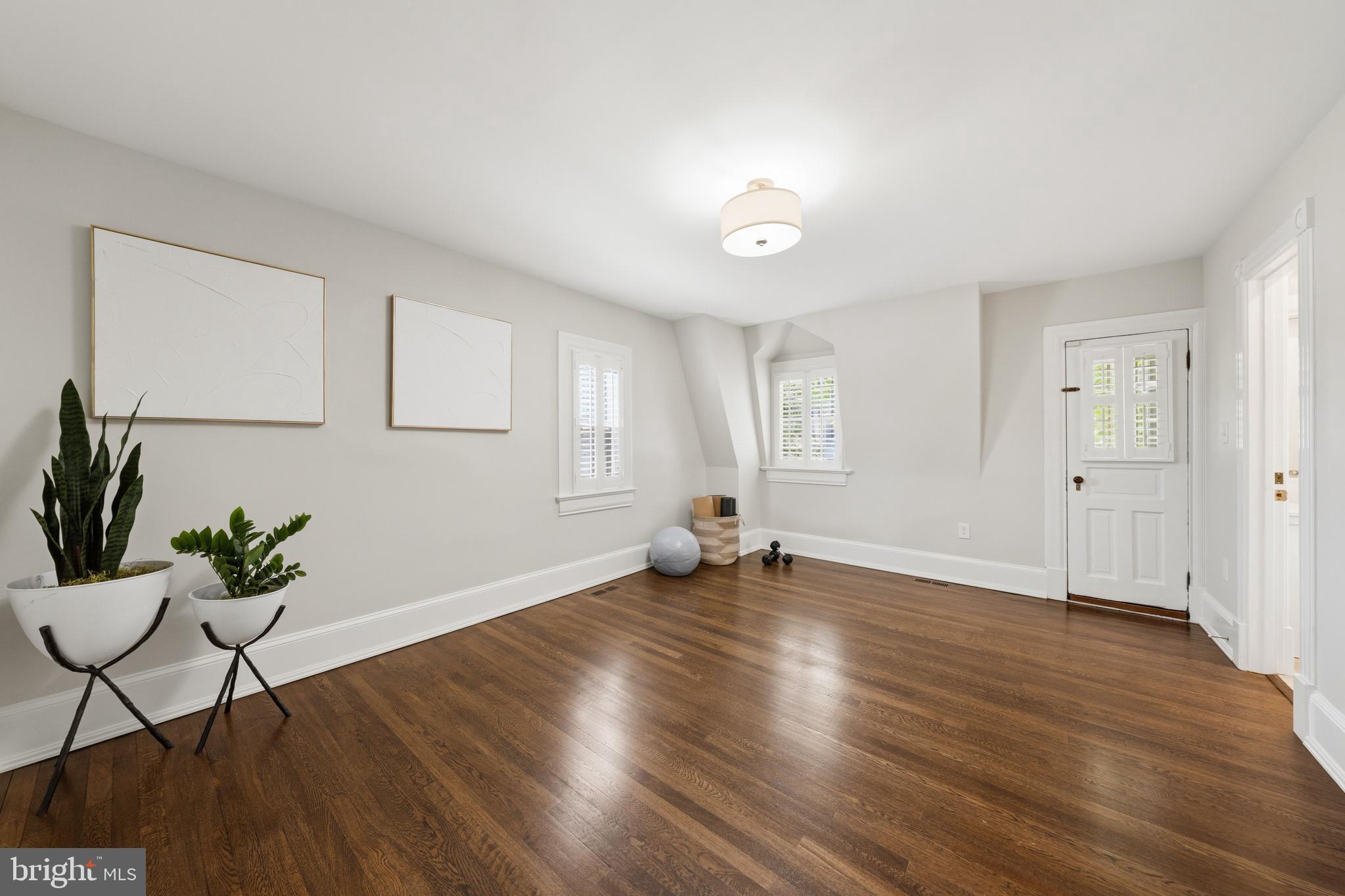 3420 P Street Northwest Washington, DC 20007 - Photo 18 of 32 a view of an empty room with wooden floor and a window