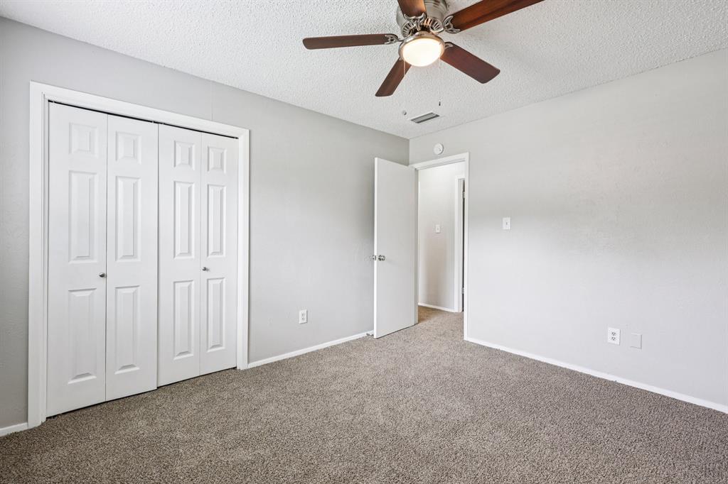 337 Apache Trail Keller, TX 76248 - Photo 16 of 36 an empty room with closet and a chandelier fan
