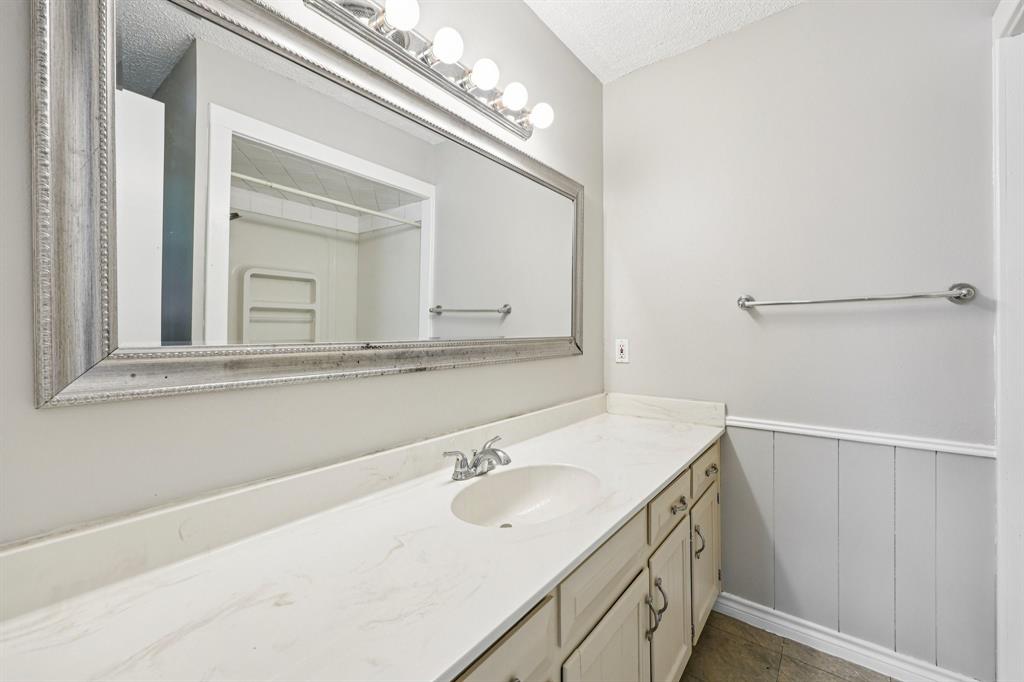 337 Apache Trail Keller, TX 76248 - Photo 20 of 36 a bathroom with a sink vanity and a mirror